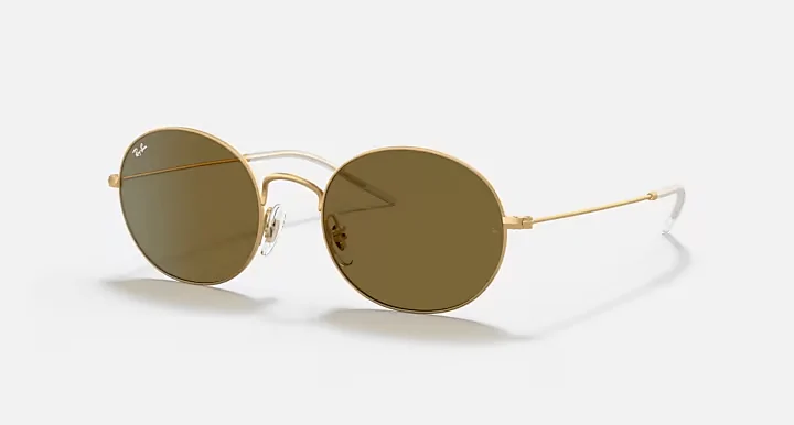 Ray-Ban Round Metal sunglasses with gold frames and amber lenses, perfect for exploring the scenic landscapes surrounding Panama City Beach.