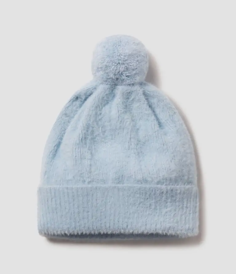 Light blue Southern Shirt knit beanie with pom-pom, perfect for chilly mornings in Panama City Beach.