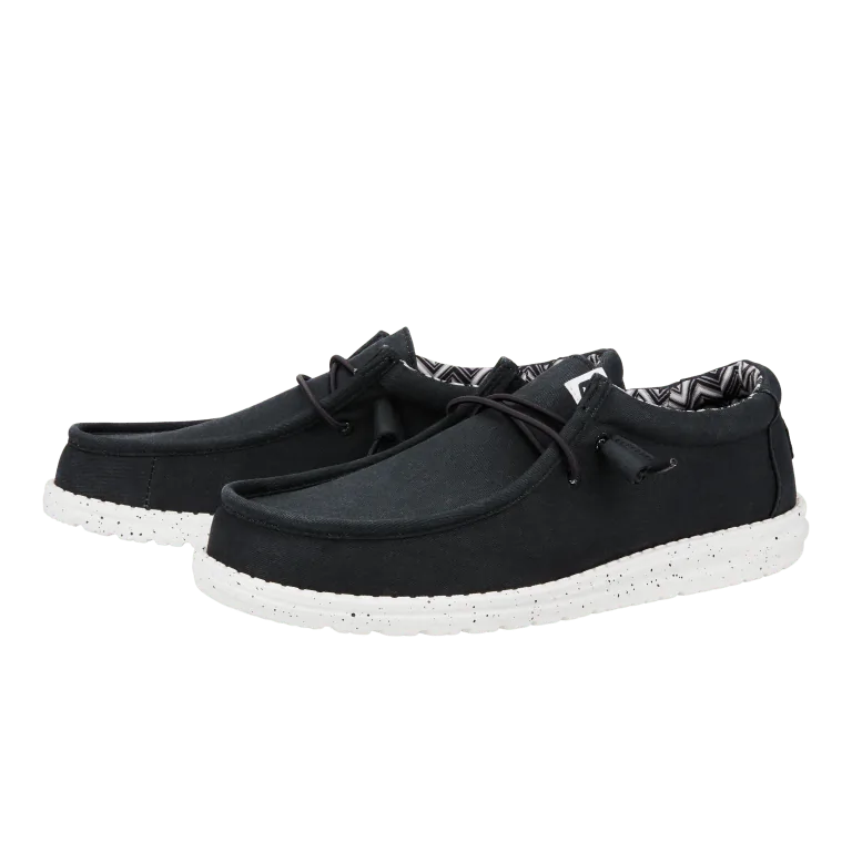 Black HEYDUDE slip-on shoes, designed for lightweight comfort and casual wear in Panama City Beach.
