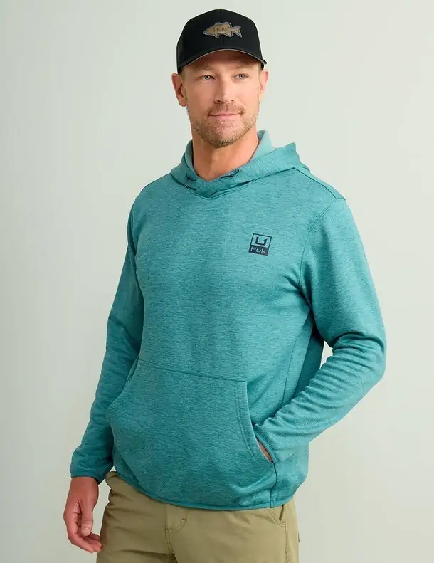 Men's teal Huk hoodie, perfect for cool mornings on the water in 30A.