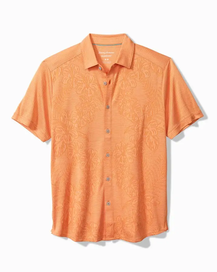 Orange Tommy Bahama short-sleeve button-up shirt with an embossed floral design, a stylish option for Destin boardwalk strolls and evening dining.