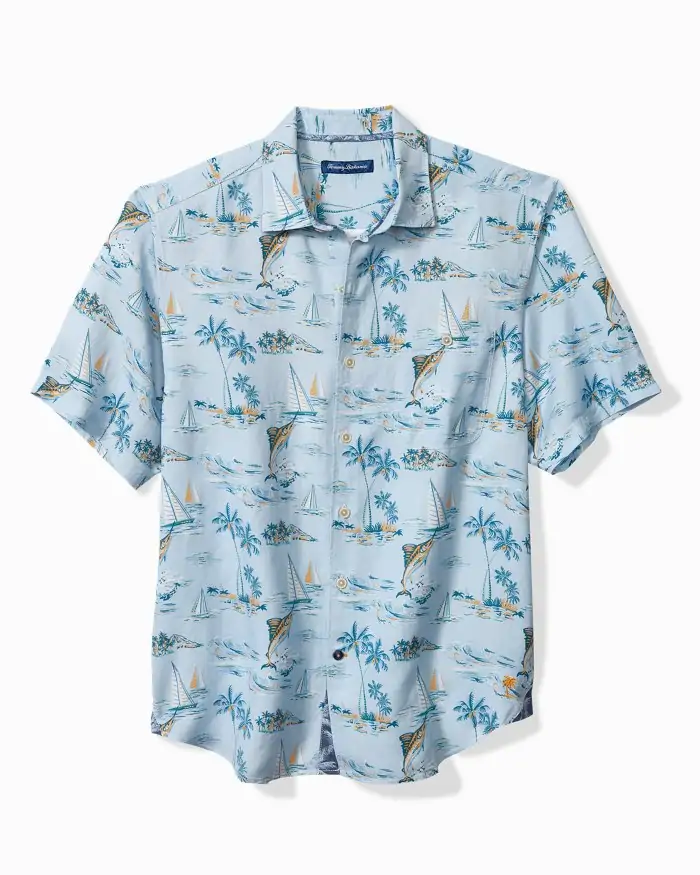 Light blue Tommy Bahama short-sleeve button-up shirt with a tropical sailboat and island print, ideal for 30A vacations or Fort Walton Beach outings.
