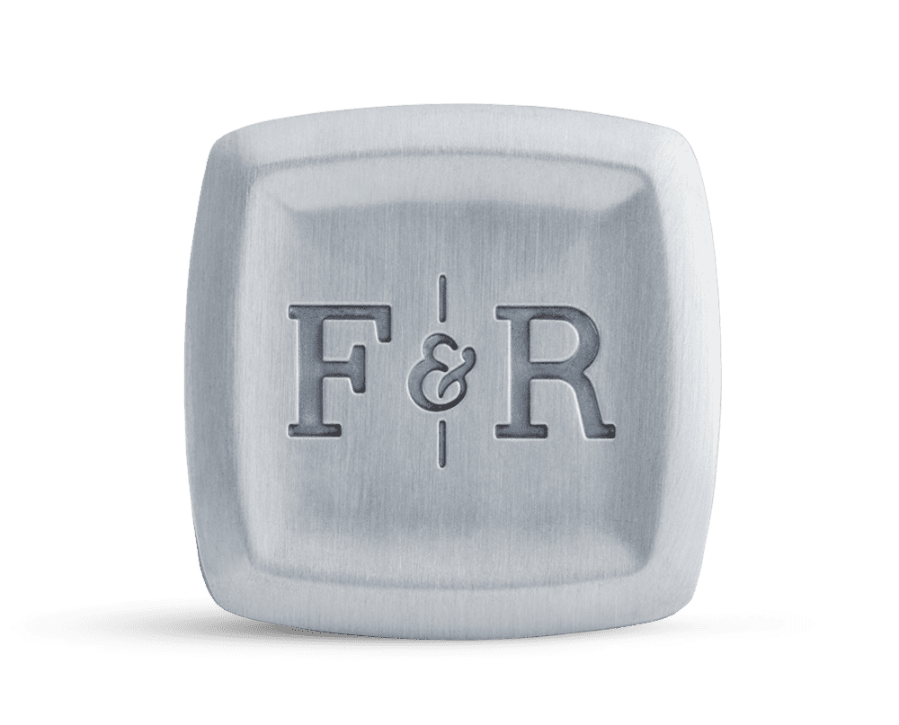 A sleek and durable metal container with the Fulton & Roark logo, perfect for carrying your favorite solid cologne on adventures along Florida Panhandle beaches such as Panama City Beach, Destin, or Grayton Beach.