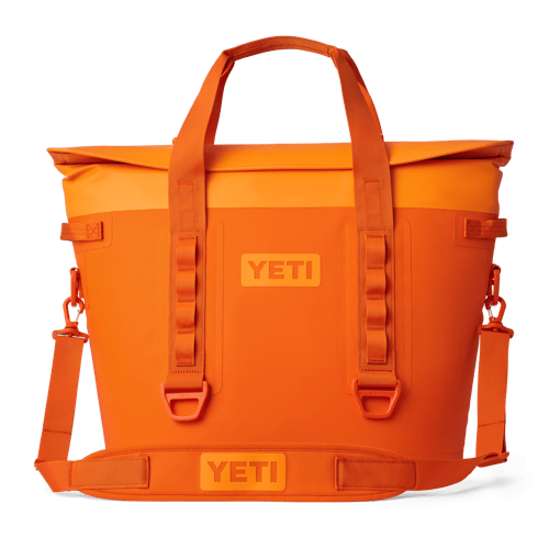 Bright orange soft cooler with spacious capacity, great for outdoor picnics and vibrant sunsets along 30A.