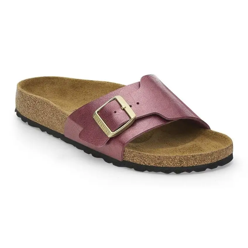 Stylish pink Birkenstock sandal with a metallic finish and a bold buckle design, perfect for Panama City Beach boardwalk strolls.