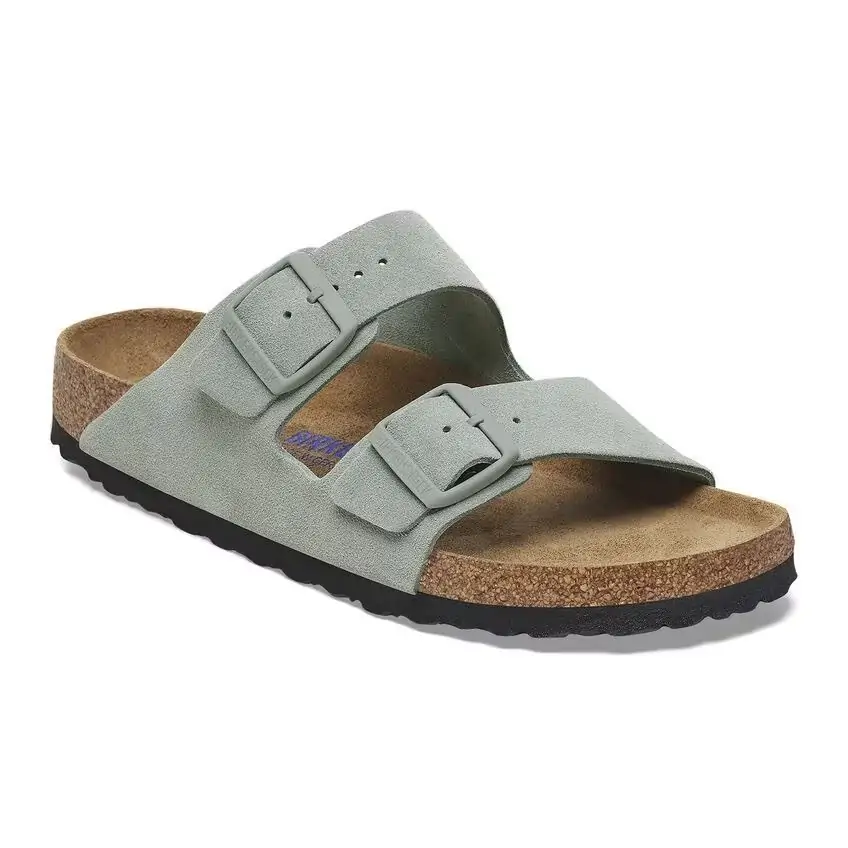 Soft sage-green suede Birkenstock sandal with a classic double-strap design, a must-have for relaxing on 30A’s scenic beaches.