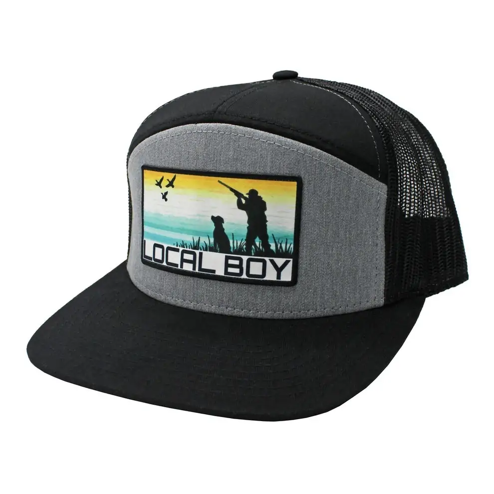 Black and gray mesh-back hat with a sunset hunting scene patch by Local Boy Outfitters, great for outdoor activities and beach days along the Florida Gulf Coast.