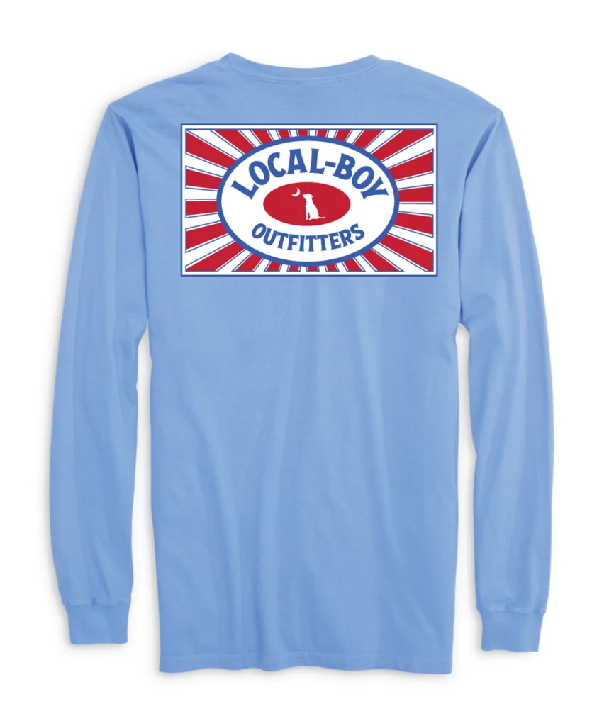 Light blue long-sleeve shirt with the Local Boy Outfitters logo featuring a dog silhouette, crescent moon, and red-white sunburst design, perfect for coastal style in Panama City Beach, Florida.