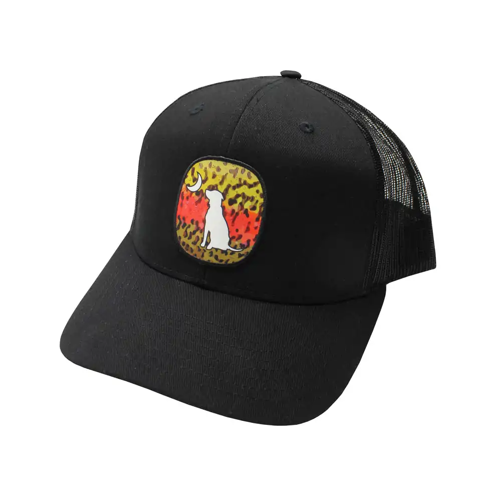 Black mesh-back hat with a camo-themed patch featuring the Local Boy Outfitters dog silhouette and crescent moon, great for outdoor enthusiasts in Grayton Beach and beyond.